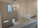 Bright and airy stairwell with chandelier at 4937 S Trout Crest, Raleigh, NC 27604