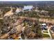 Aerial view of a neighborhood near a lake and a golf course at 501 Queensferry Rd, Cary, NC 27511