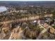 Aerial view showcasing a neighborhood near a lake and golf course at 501 Queensferry Rd, Cary, NC 27511