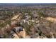 Aerial view of homes near a golf course and mature trees at 501 Queensferry Rd, Cary, NC 27511