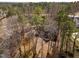 An aerial view shows the property nestled among dense trees at 501 Queensferry Rd, Cary, NC 27511
