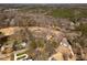 Aerial view of houses near a golf course surrounded by mature trees at 501 Queensferry Rd, Cary, NC 27511