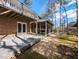 View of the home's backyard including the deck, sunroom, and basketball hoop at 501 Queensferry Rd, Cary, NC 27511