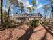 The back of the home features a screened-in porch and balcony at 501 Queensferry Rd, Cary, NC 27511