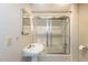 Bathroom with a standard tub-shower combo and pedestal sink with medicine cabinet mirror at 501 Queensferry Rd, Cary, NC 27511