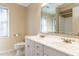 Bright bathroom with double sinks, a toilet, and window providing natural light at 501 Queensferry Rd, Cary, NC 27511