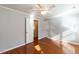 Bedroom with hardwood floors, a ceiling fan, and two closets at 501 Queensferry Rd, Cary, NC 27511
