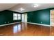 Spacious bedroom with hardwood floors and natural light from a large window at 501 Queensferry Rd, Cary, NC 27511