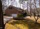 Brick home with an attached garage and mature landscaping at 501 Queensferry Rd, Cary, NC 27511