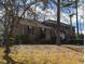 Traditional brick home with black shutters and mature trees on a spacious lot and walkway at 501 Queensferry Rd, Cary, NC 27511