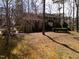 Traditional-style brick home with a well-manicured lawn and mature trees at 501 Queensferry Rd, Cary, NC 27511