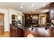 Well-equipped kitchen with granite countertops, custom cabinets, and a stainless steel refrigerator at 501 Queensferry Rd, Cary, NC 27511