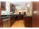 Open concept kitchen with stainless steel appliances and granite countertops provides ample workspace at 501 Queensferry Rd, Cary, NC 27511