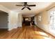 Open floor plan seamlessly connects the living room to the kitchen, featuring hardwood floors at 501 Queensferry Rd, Cary, NC 27511