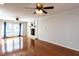 Inviting living room with a fireplace, hardwood floors, and a ceiling fan, ideal for relaxation at 501 Queensferry Rd, Cary, NC 27511