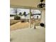 Covered patio overlooking a backyard with firepit, storage sheds, and gravel landscaping at 59 Mar-Joy Dr, Dunn, NC 28334