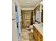 Main bathroom with walk-in shower, grab bars, and updated vanity at 59 Mar-Joy Dr, Dunn, NC 28334