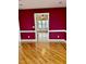View into kitchen from dining room, both with hardwood floors at 59 Mar-Joy Dr, Dunn, NC 28334