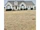 One-story house with a large front yard and attached garage at 59 Mar-Joy Dr, Dunn, NC 28334