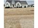 House exterior showcasing landscaping and a carport at 59 Mar-Joy Dr, Dunn, NC 28334