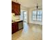 Bright kitchen with wood cabinets, stainless steel appliances, and access to a deck overlooking the water at 59 Mar-Joy Dr, Dunn, NC 28334