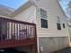 Back deck with red railing and steps at 6020 Newhall Rd, Durham, NC 27713