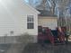 House exterior showcasing a red deck and steps at 6020 Newhall Rd, Durham, NC 27713