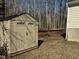 Tan colored storage shed in backyard at 6020 Newhall Rd, Durham, NC 27713