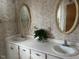Double vanity bathroom with updated sinks and oval mirrors at 8110 Nc 210 N, Angier, NC 27501