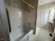 Clean bathroom with a shower/tub combo and built-in shelving at 8110 Nc 210 N, Angier, NC 27501