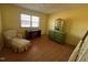 Bedroom with hardwood floors and vintage furniture at 8110 Nc 210 N, Angier, NC 27501