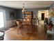 Bright dining room features hardwood floors and a classic wooden table with chairs at 8110 Nc 210 N, Angier, NC 27501