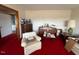 Living room with piano, vintage furniture, and red carpet at 8110 Nc 210 N, Angier, NC 27501