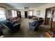 Bright living room with two comfy armchairs and a sofa at 8110 Nc 210 N, Angier, NC 27501