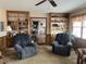 Relaxing living room featuring two comfy armchairs and built-in shelving at 8110 Nc 210 N, Angier, NC 27501