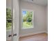 Bright bedroom with wood floors and a view of the backyard at 8805 Melvin St # 35, Willow Springs, NC 27592