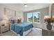 Bedroom with two windows, a queen bed, and natural light at 8805 Melvin St # 35, Willow Springs, NC 27592