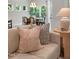 Living area with neutral colored couches and a view into the dining area at 8805 Melvin St # 35, Willow Springs, NC 27592