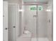 Large walk-in shower with tiled walls and a built-in seat at 8805 Melvin St # 35, Willow Springs, NC 27592