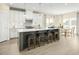 Modern kitchen with white cabinets, stainless steel appliances, and an island at 8829 Tartan Clan Dr, Willow Springs, NC 27592