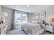 Cozy bedroom with large windows and neutral decor at 101 Cloud Berry Ln, Holly Springs, NC 27540