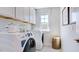 Laundry room with washer, dryer, and cabinets at 101 Cloud Berry Ln, Holly Springs, NC 27540