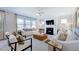 Spacious living room featuring a fireplace and large windows at 101 Cloud Berry Ln, Holly Springs, NC 27540