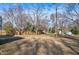 Large backyard with mature trees and some landscaping at 110 Summit Ave, Raleigh, NC 27603