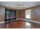 Simple bedroom with hardwood floors and a ceiling fan at 110 Summit Ave, Raleigh, NC 27603