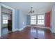 Dining room with hardwood floors and two windows at 110 Summit Ave, Raleigh, NC 27603