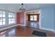Dining room with hardwood floors and view into living room at 110 Summit Ave, Raleigh, NC 27603