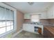Kitchen with white cabinets and vinyl flooring at 110 Summit Ave, Raleigh, NC 27603