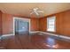 Spacious living room featuring hardwood floors and ceiling fan at 110 Summit Ave, Raleigh, NC 27603