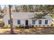 White house with black windows and steps at 1117 Beechwood Dr, Rocky Mount, NC 27803